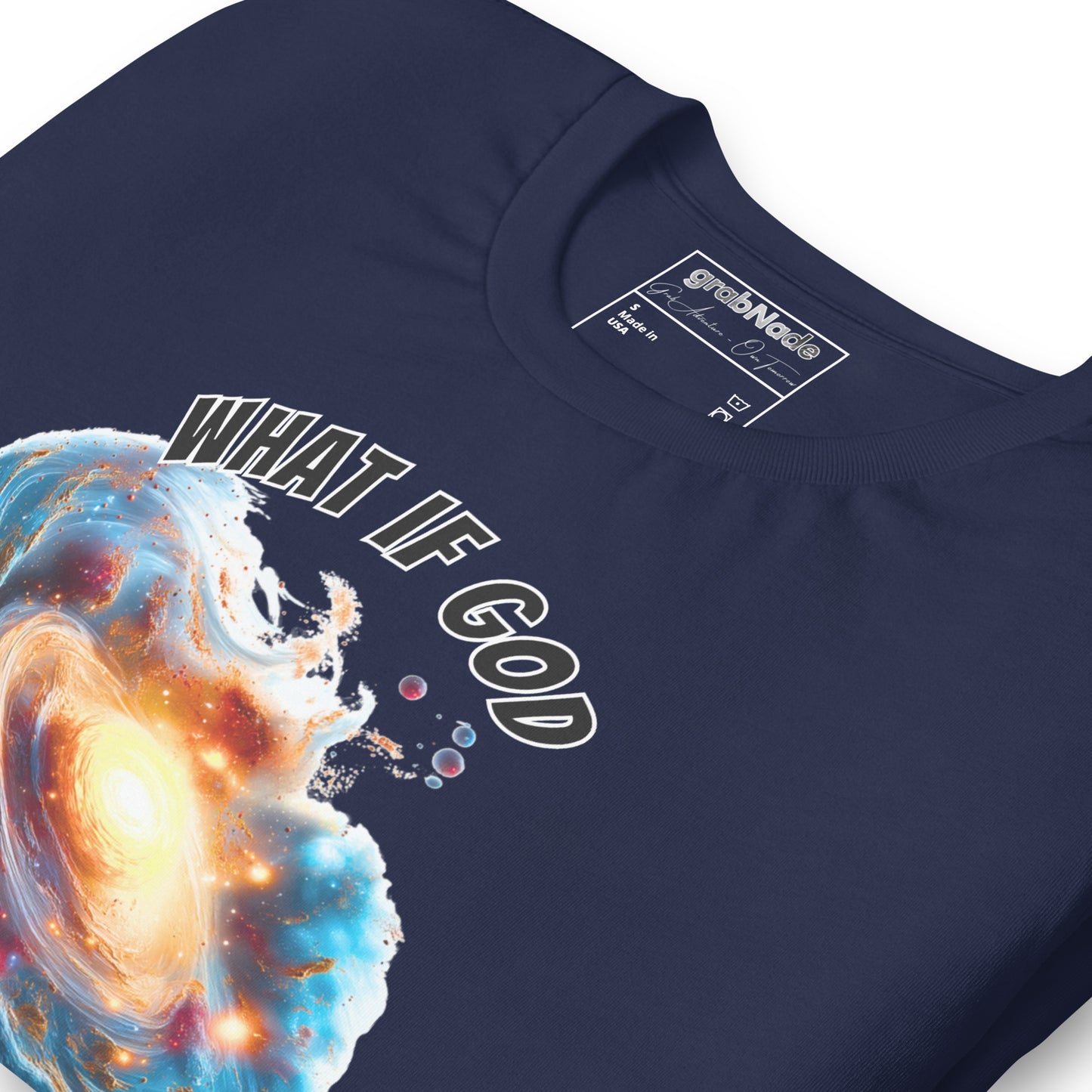 Product mockup. Close-up of navy blue T-shirt showing cosmic explosion graphic with text, "WHAT IF GOD CREATED THE BIG BANG?"