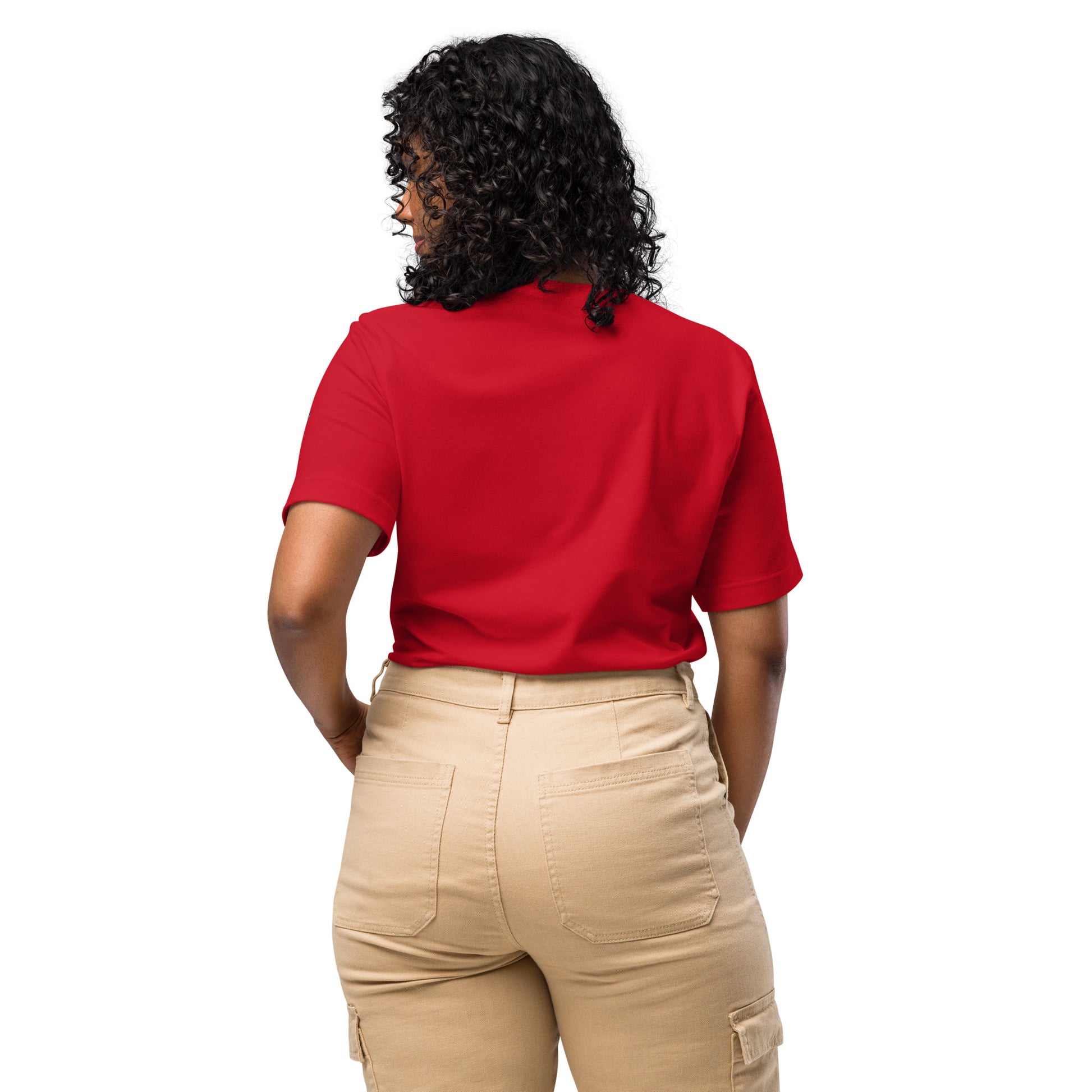 Product mockup. Woman with curly hair shown from the back, wearing a plain red T-shirt and beige cargo pants.
