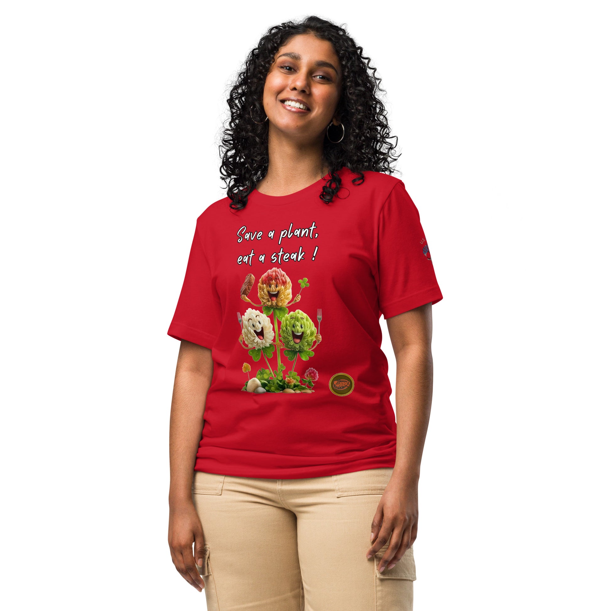 Product mockup. Woman standing and smiling in a red T-shirt with "Save a plant, eat a steak!" and three flower-style smiling vegetables.