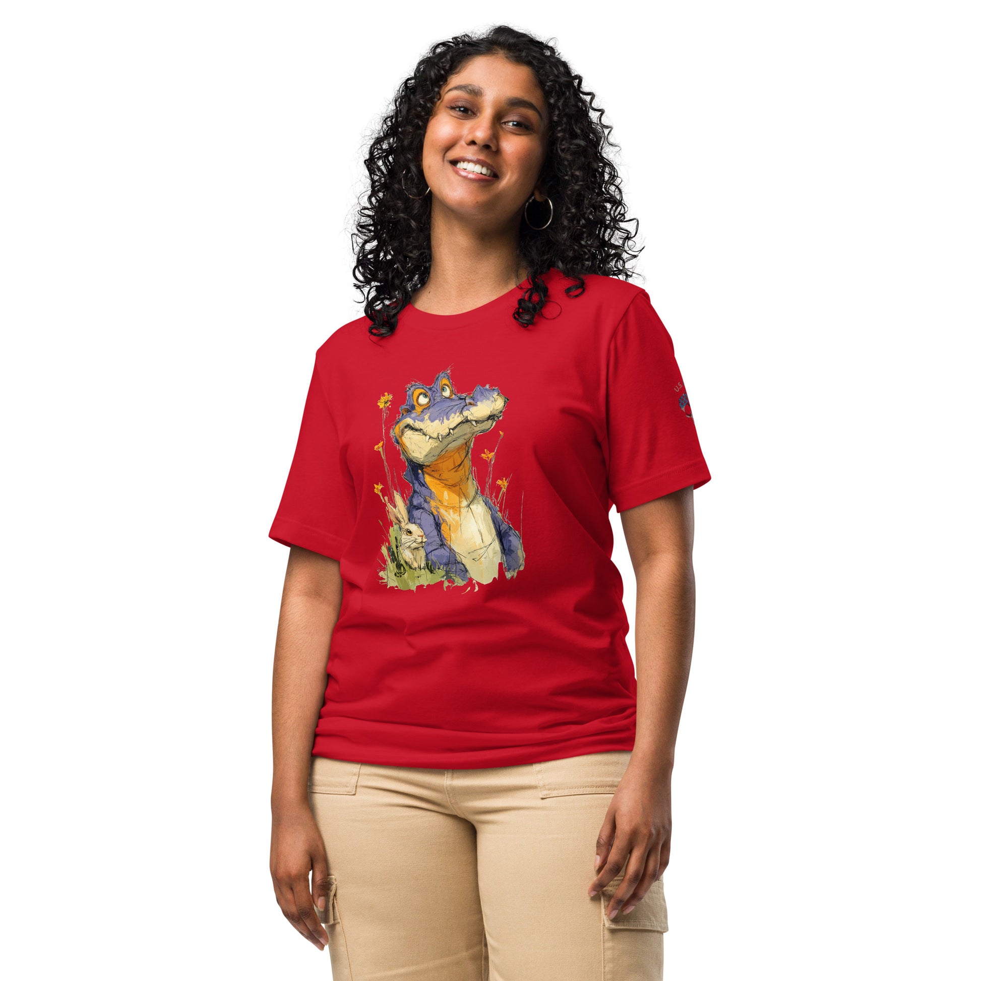 Product mockup. Woman in red T-shirt with whimsical cartoon alligator/crocodile and yellow wildflowers, smiling bunny beside it.