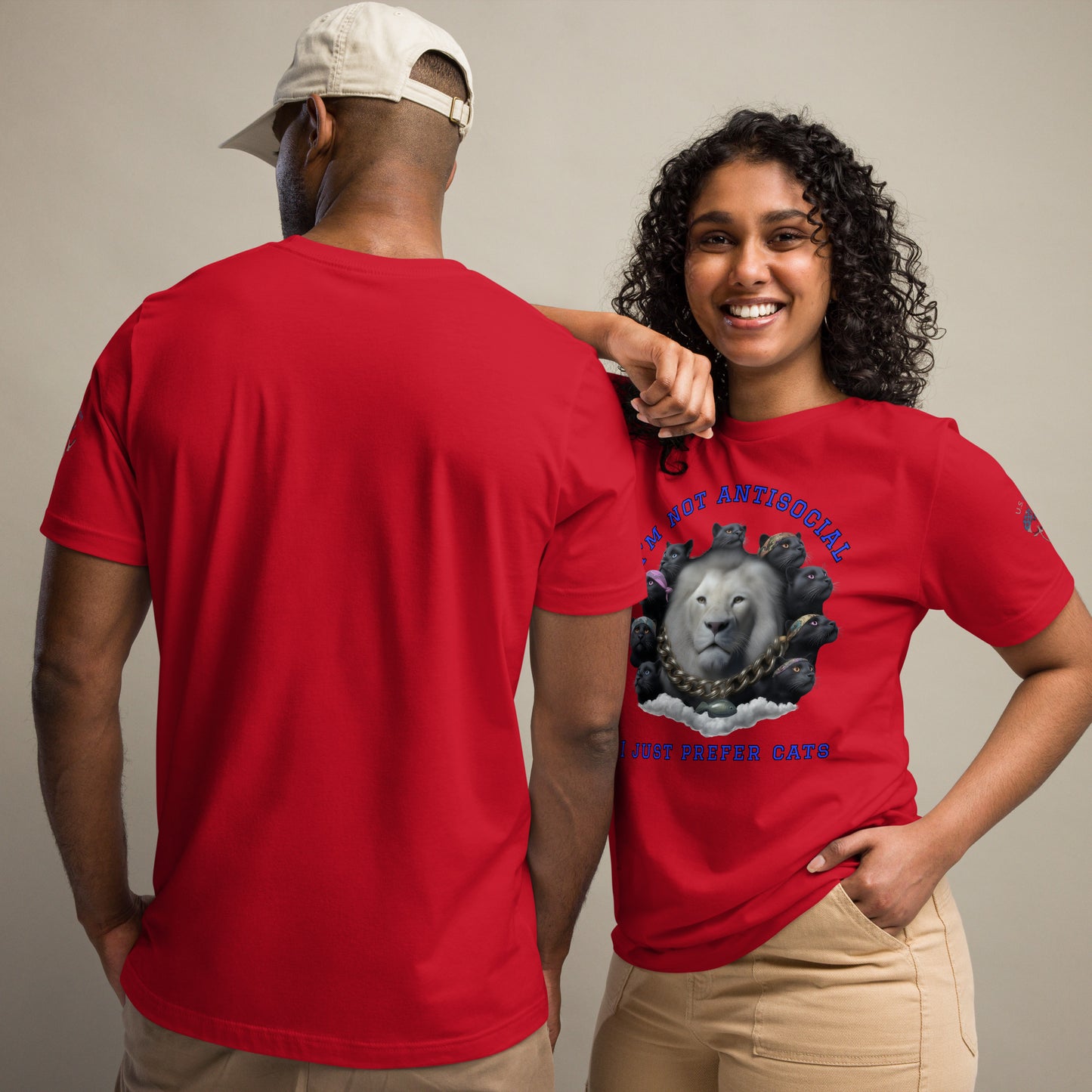 Product mockup. Woman modeling red T-shirt with large white lion surrounded by black cats, featuring blue text: "I’m not antisocial, I just prefer cats".