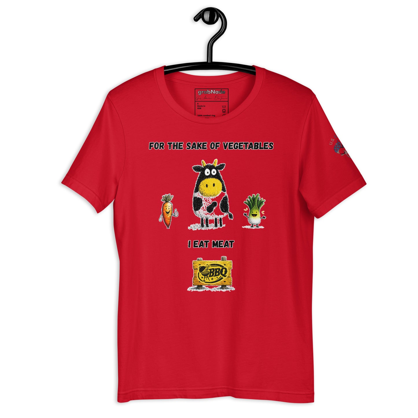 Product mockup. Red T-shirt on a hanger decorated with a cartoon cow and smiling vegetables, text reads “For the sake of vegetables I eat meat” above a BBQ sign.
