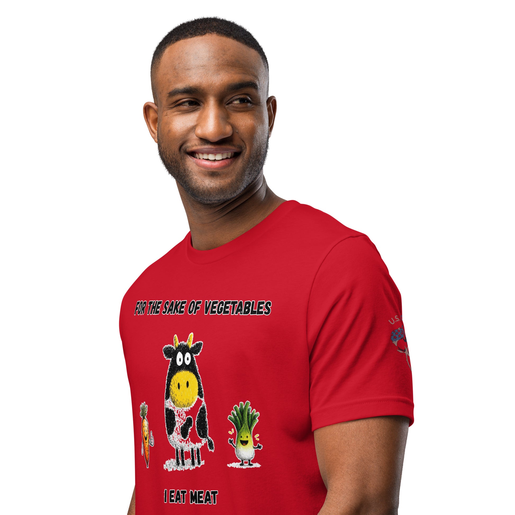 Product mockup. A man in a red T-shirt displaying cartoon vegetables and a cow illustration with the text "For the sake of vegetables I eat meat," shown from the waist up.