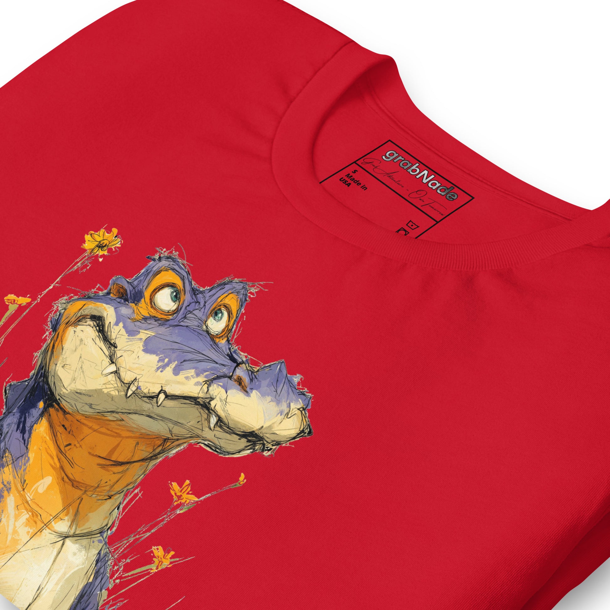 Product mockup. Close-up of a red T-shirt with a large, playful cartoon alligator surrounded by bright yellow flowers.