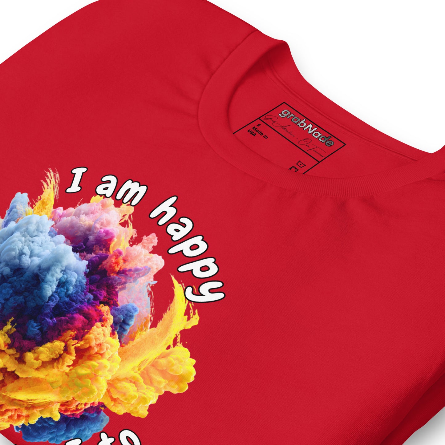 Product mockup. Close-up of a red T-shirt with blended colorful clouds and the white text “I am happy because I choose to.”