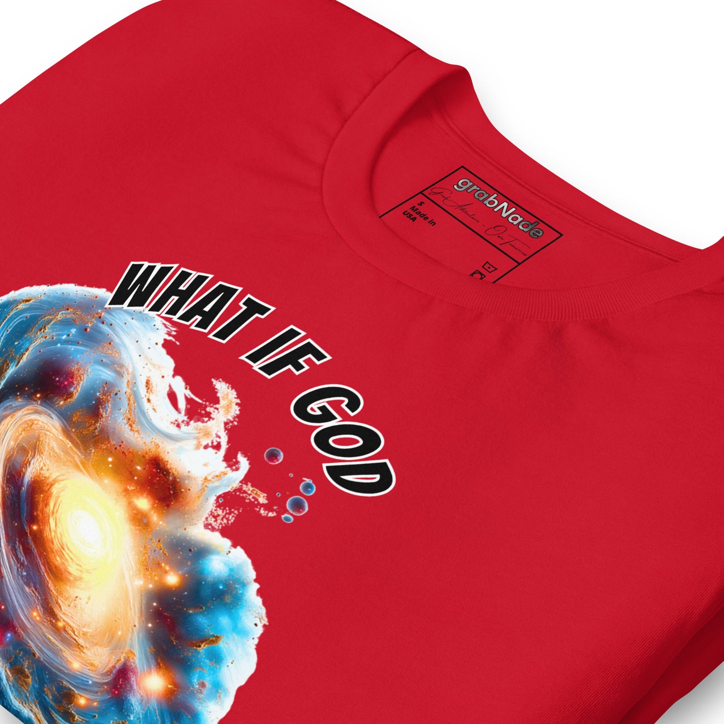 Product mockup. Close-up of a red T-shirt featuring a vibrant spiral galaxy and the large text “WHAT IF GOD”.