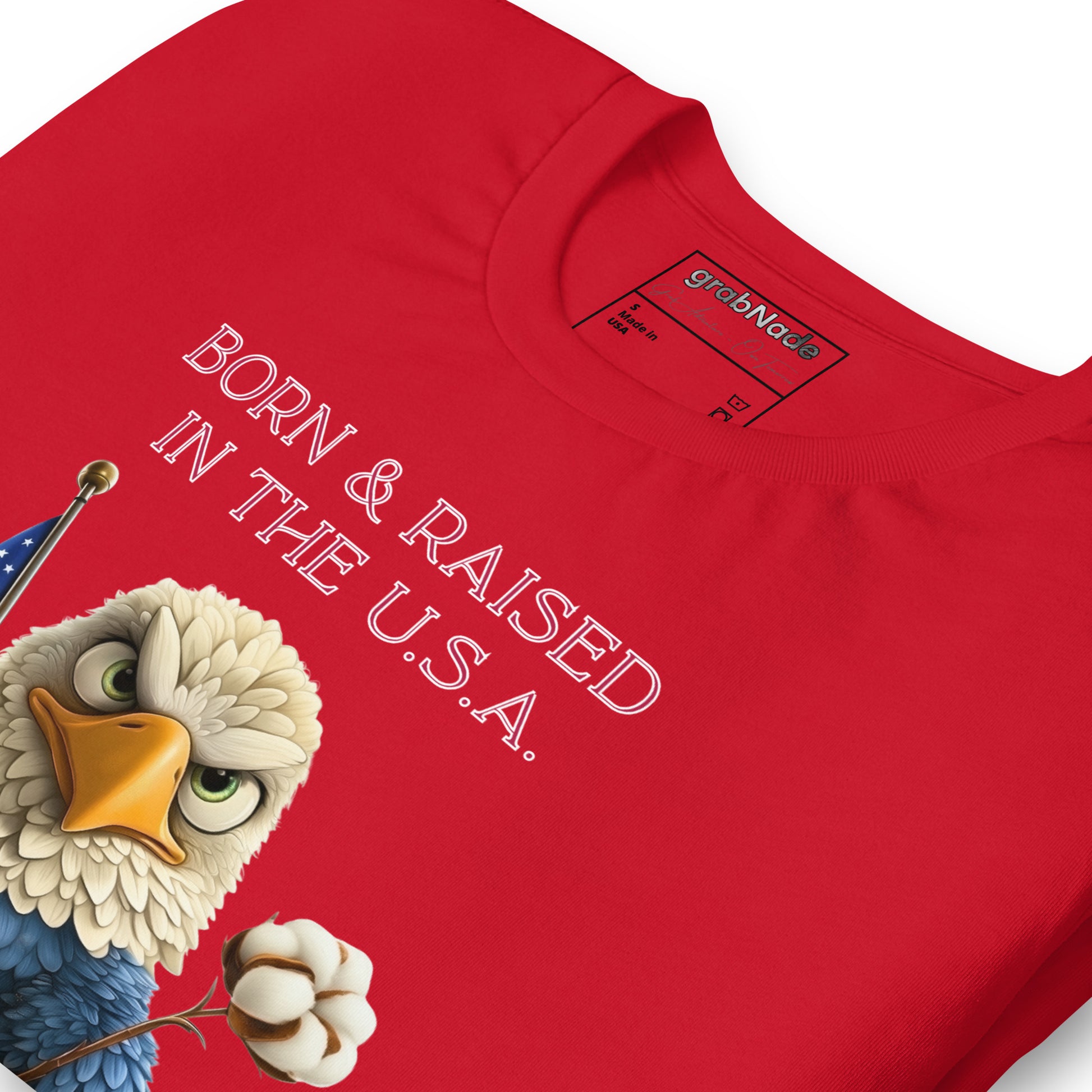 Product mockup. Premium red cotton t-shirt flat close-up; detailed print of eagle, US flag, cotton flower, and “Born & Raised in the U.S.A.” text. Combed cotton, premium quality.