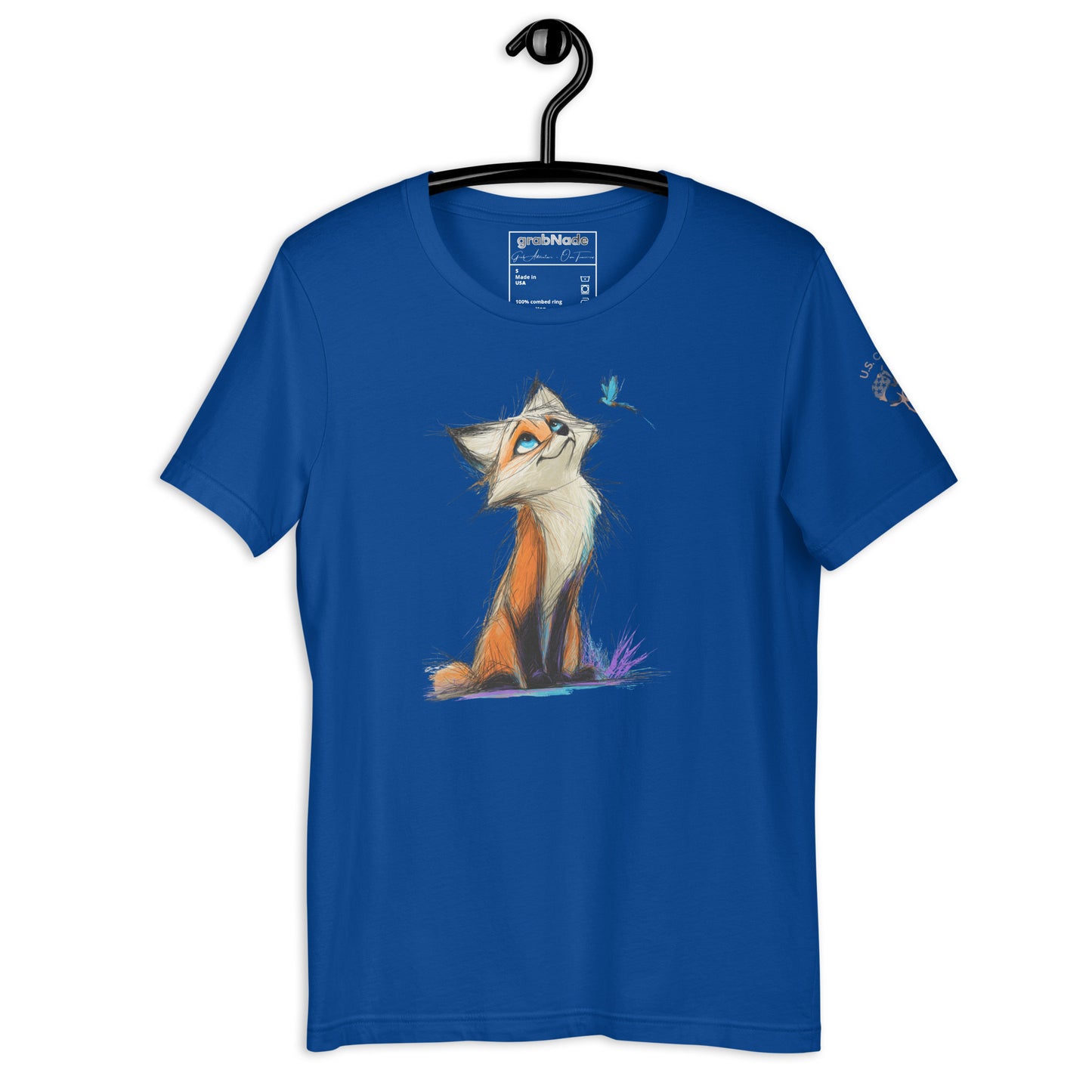 Product mockup. Blue T-shirt on hanger featuring a stylized orange fox illustration with a blue bird, sitting in purple grass.