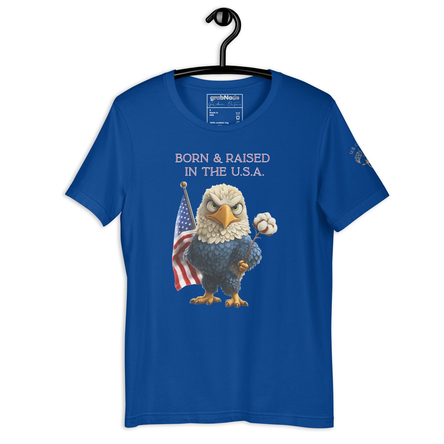 Product mockup. Blue T-shirt on a hanger printed with a cartoon bald eagle, US flag, cotton boll, and the phrase “Born & Raised in the U.S.A.”