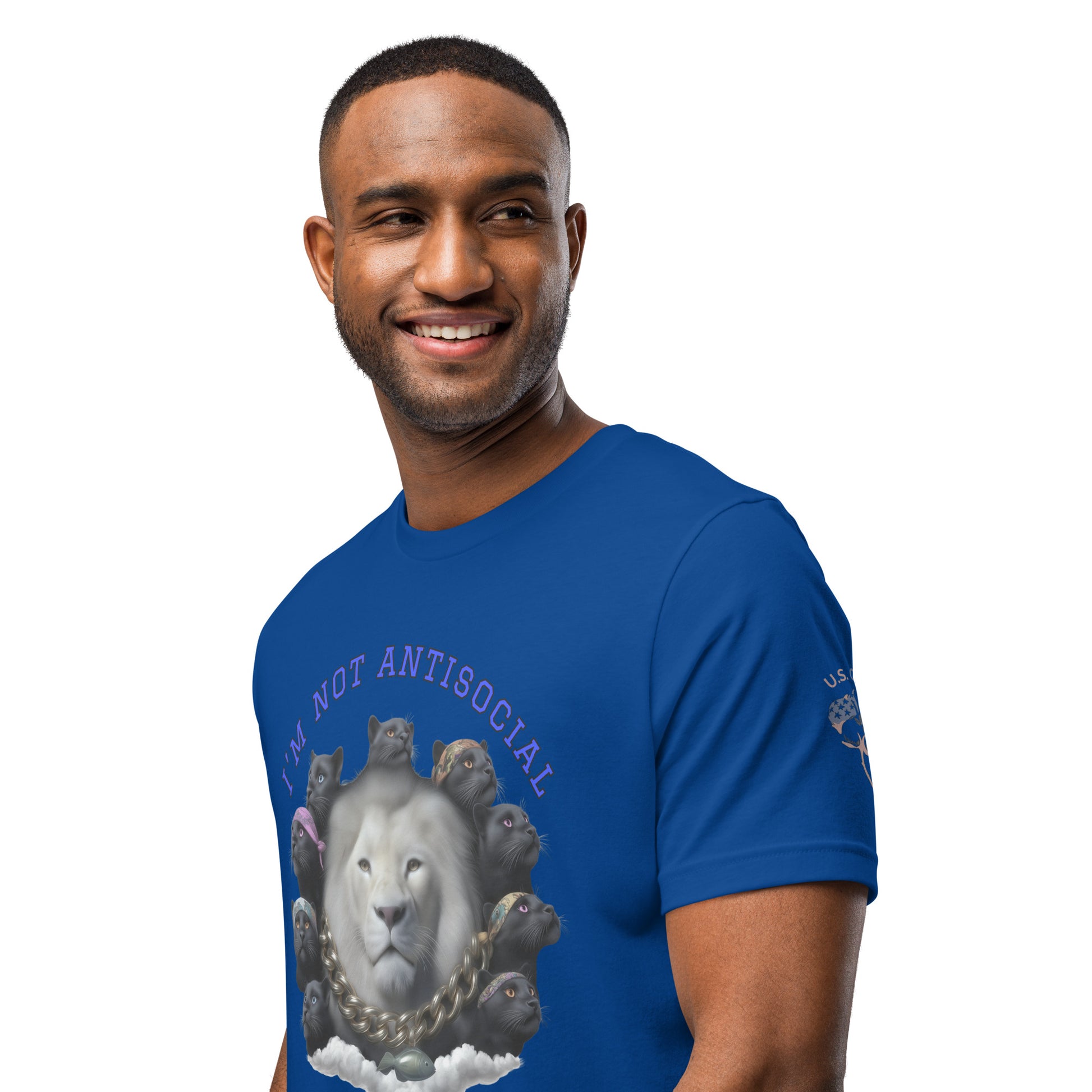 Product mockup. Blue T-shirt, left front, white lion head with gold chain, surrounded by black cats, purple text: “I’M NOT ANTISOCIAL.”, close-up from the torso up.