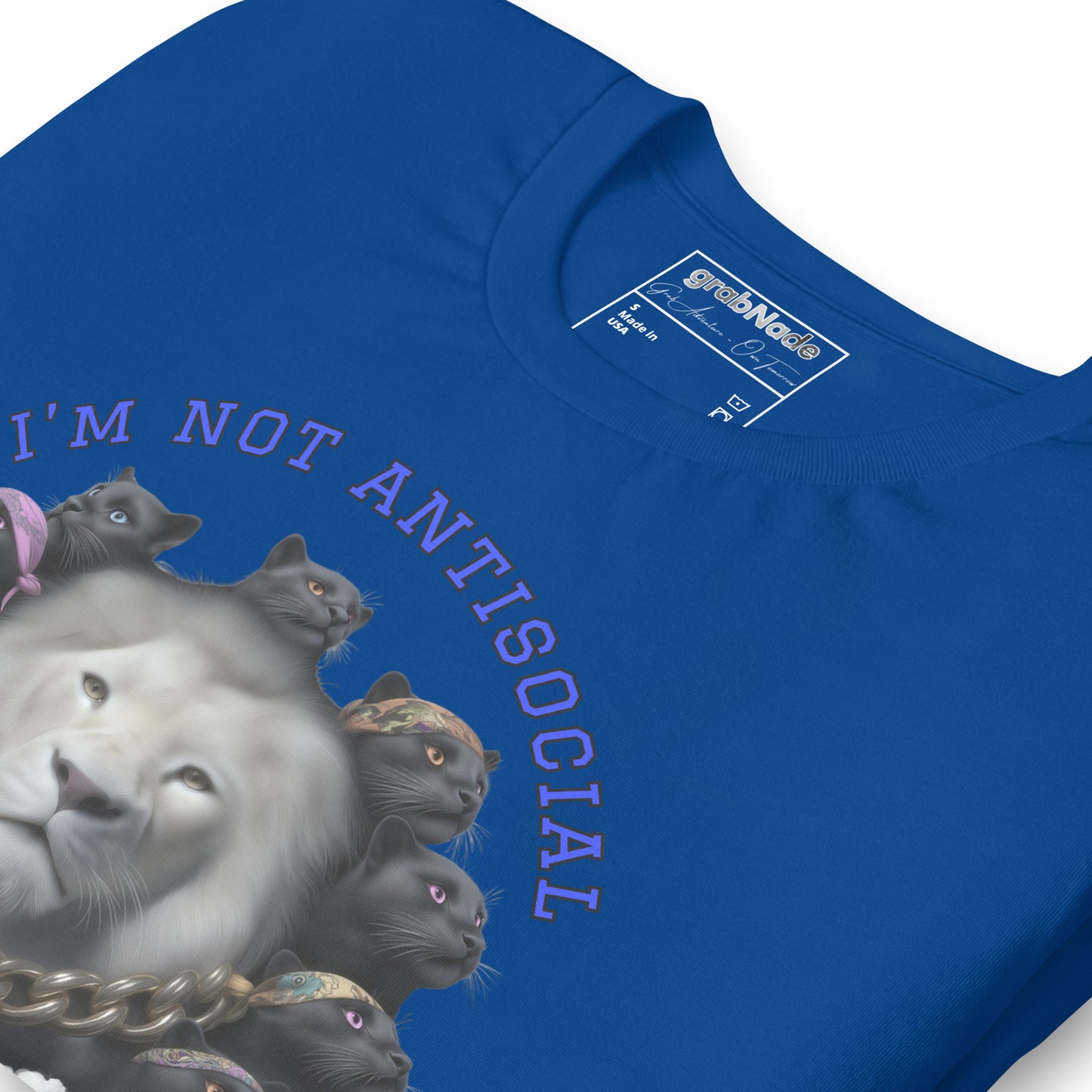 Product mockup. Blue T-shirt, zoomed in, white lion surrounded by black cats in bandanas, text: “I’M NOT ANTISOCIAL”.