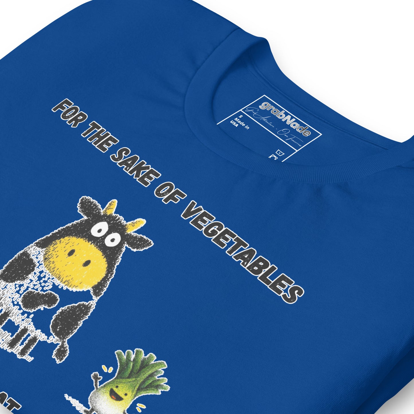 Product mockup. Blue T-shirt, zoomed in, cartoon cow and happy vegetable with text: “FOR THE SAKE OF VEGETABLES”.