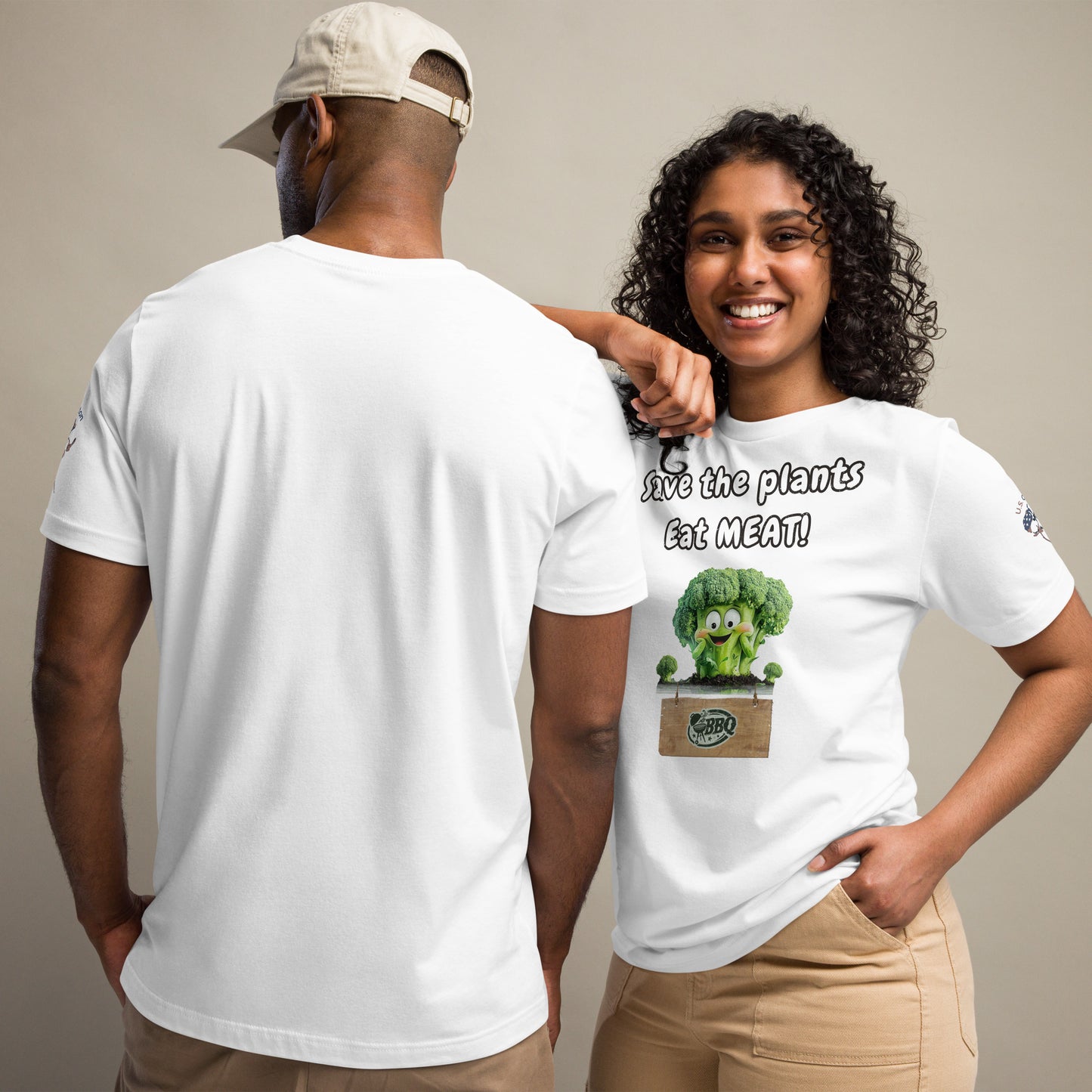 Product mockup. Man and woman in white T-shirts, woman smiles; her shirt displays a cartoon broccoli and “Save the plants, Eat MEAT!” slogan.