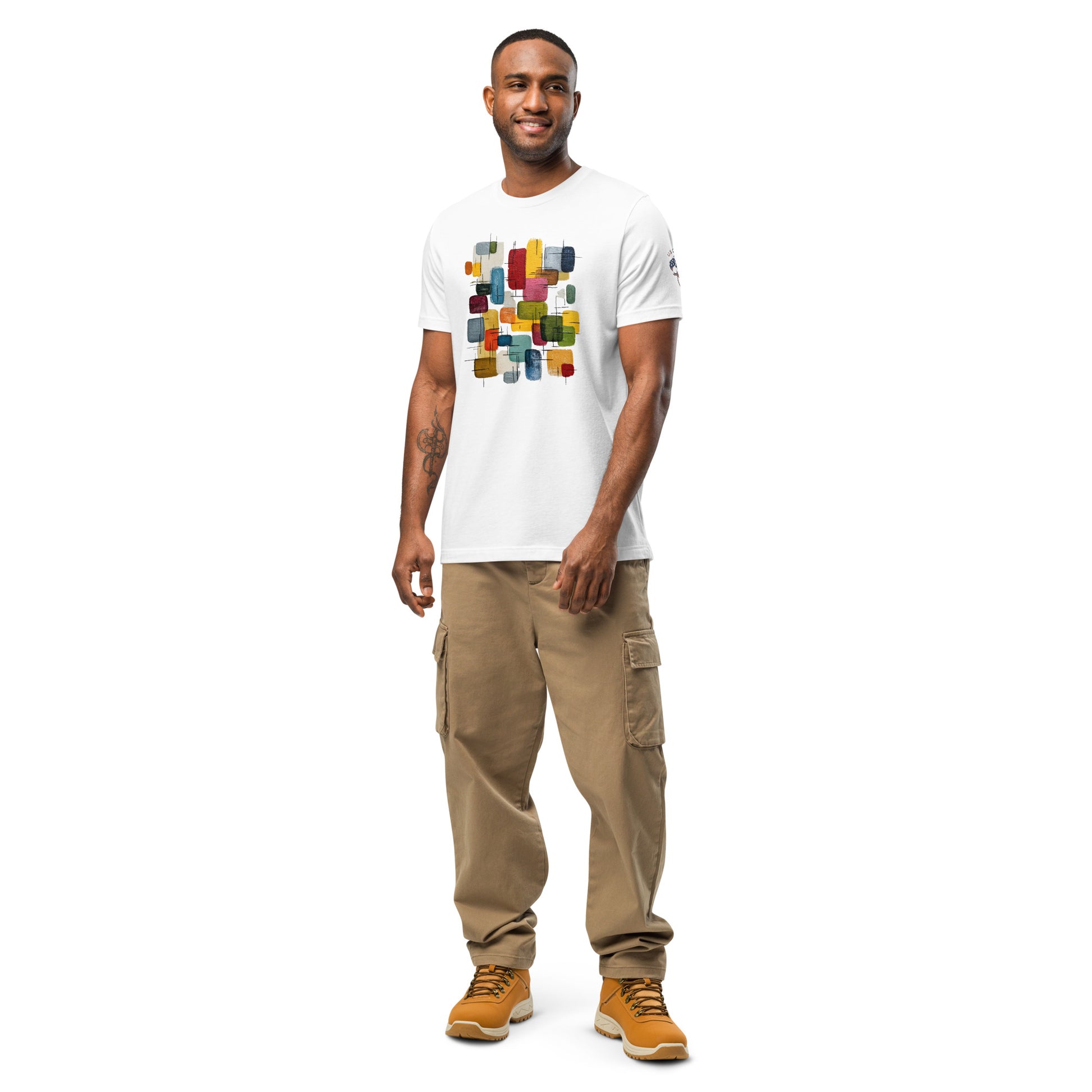 Product mockup. Smiling man wearing a white T-shirt with colorful abstract rectangles and lines.