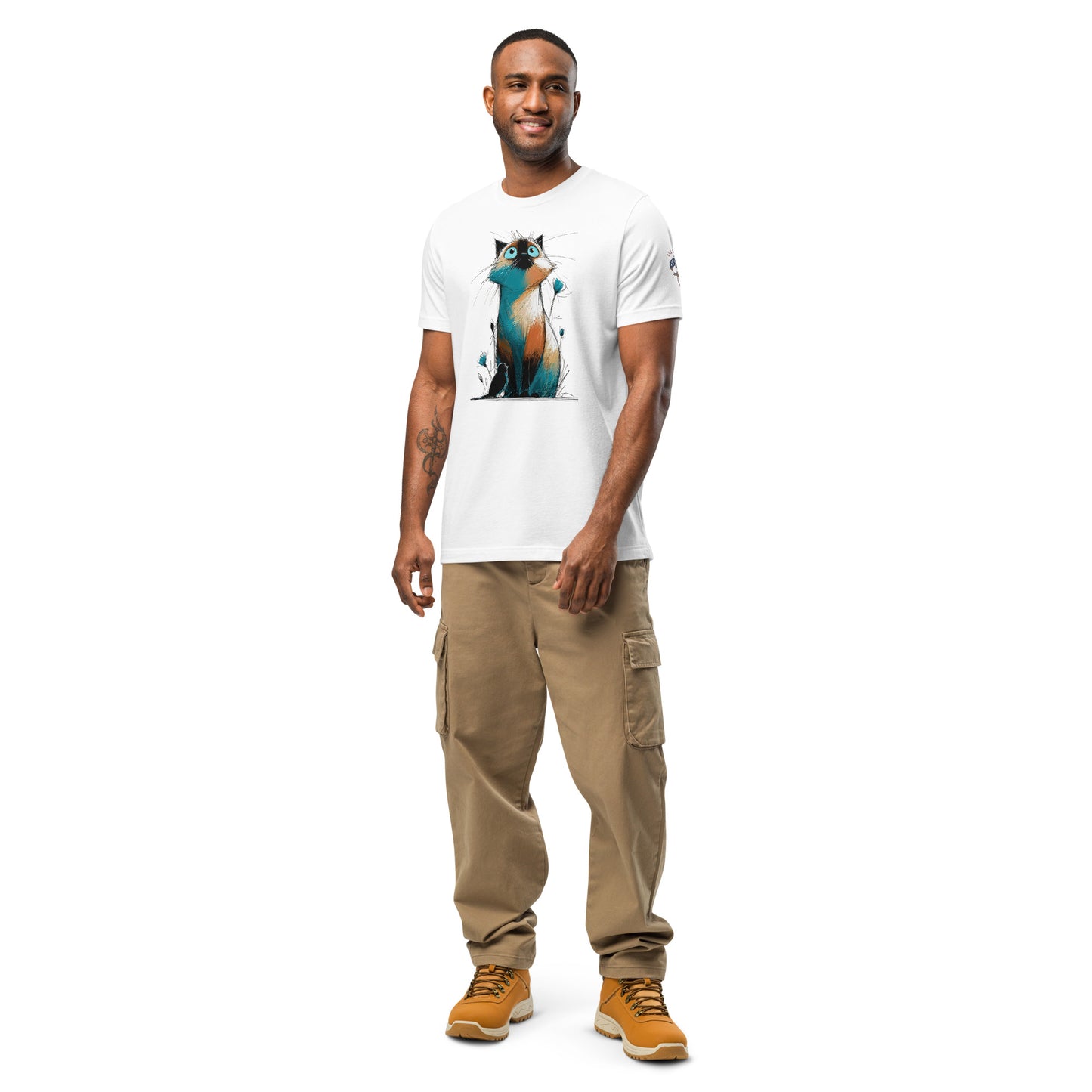 Product mockup. Man in white T-shirt featuring colorful, sketch-style illustration of a cat sitting upright, looking upward.