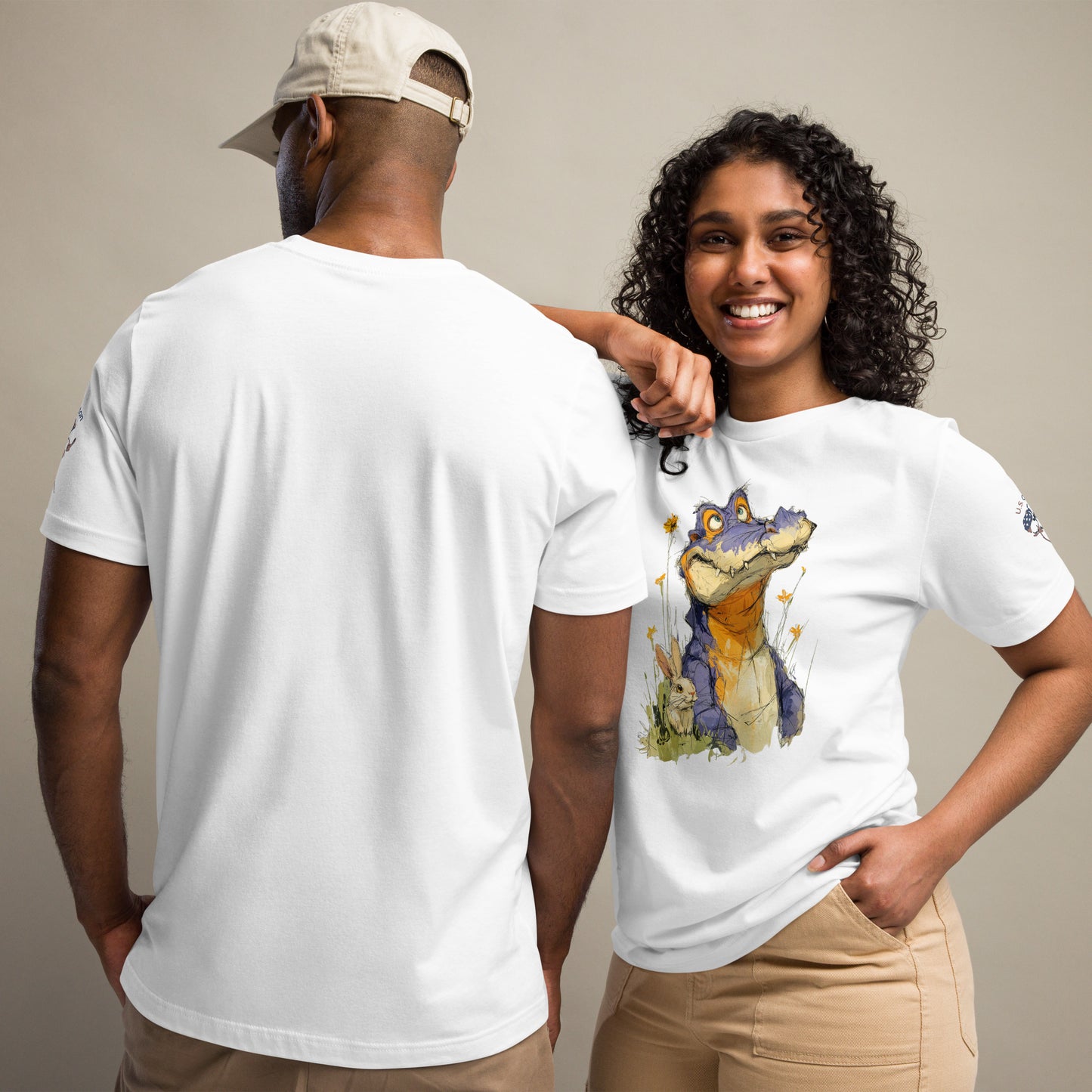 Product mockup. Man showing back of plain white T-shirt; woman in whimsical crocodile T-shirt with wildflowers.