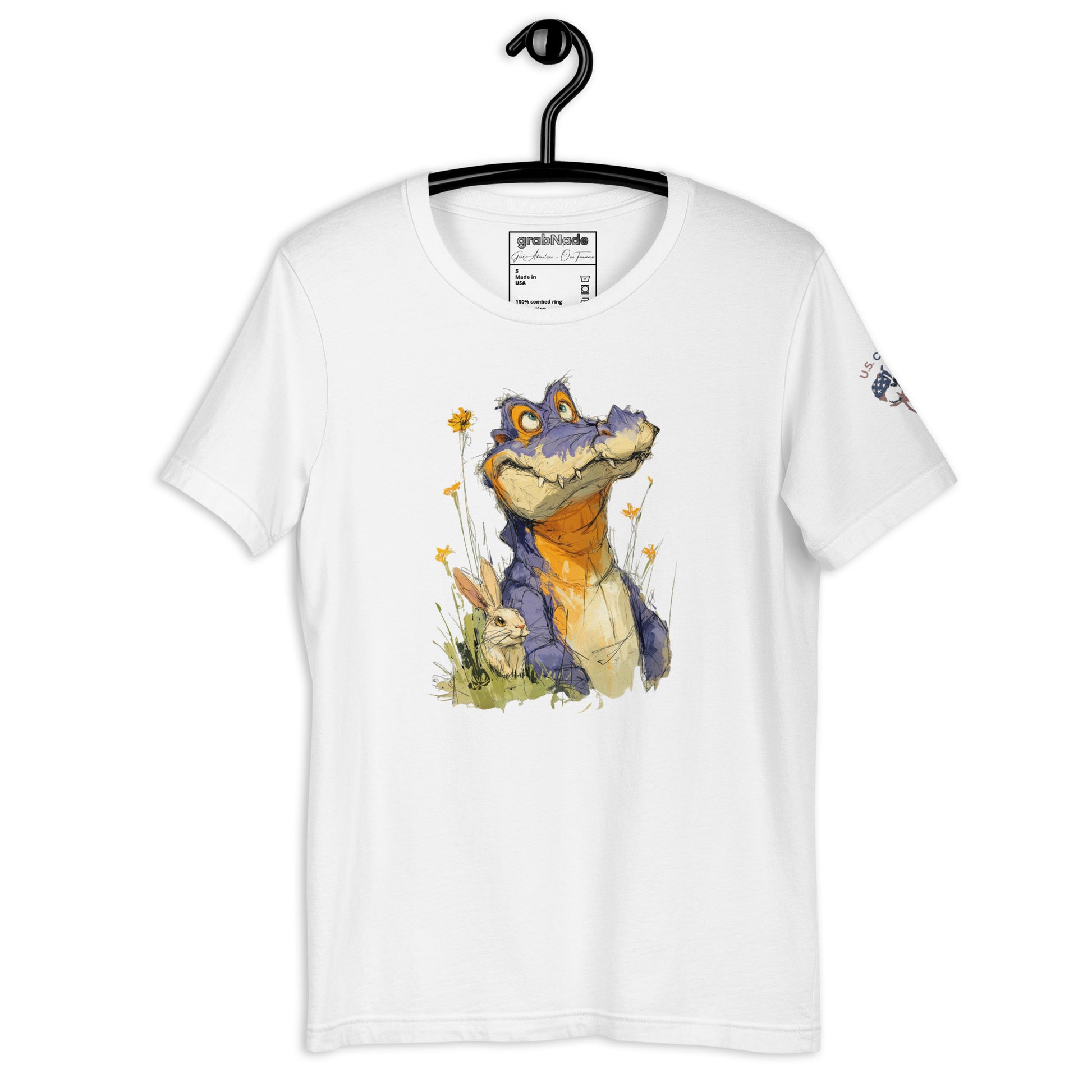 Product mockup. White T-shirt on hanger featuring colorful crocodile artwork among yellow flowers and greenery.
