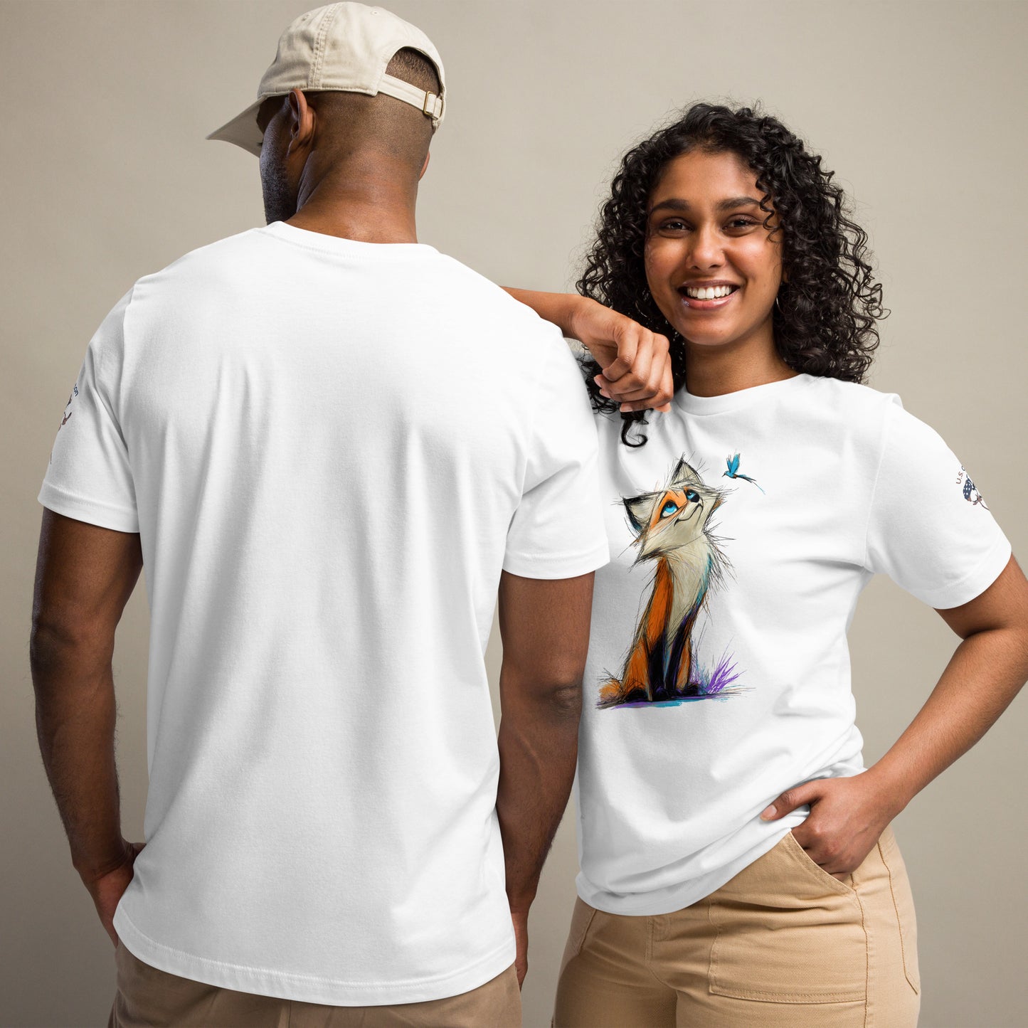 Product mockup. Man showing back of plain white T-shirt; woman in fox T-shirt with a blue bird above the fox.