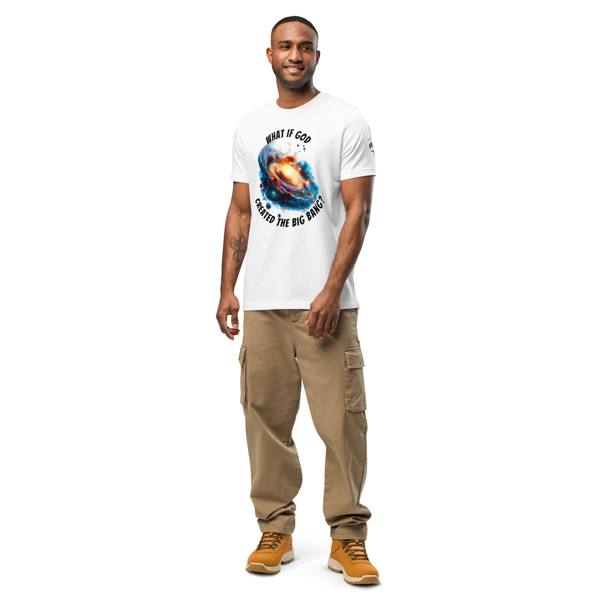 Product mockup. Man in white T-shirt featuring bright nebula art with question text: “What if God created the Big Bang?”.
