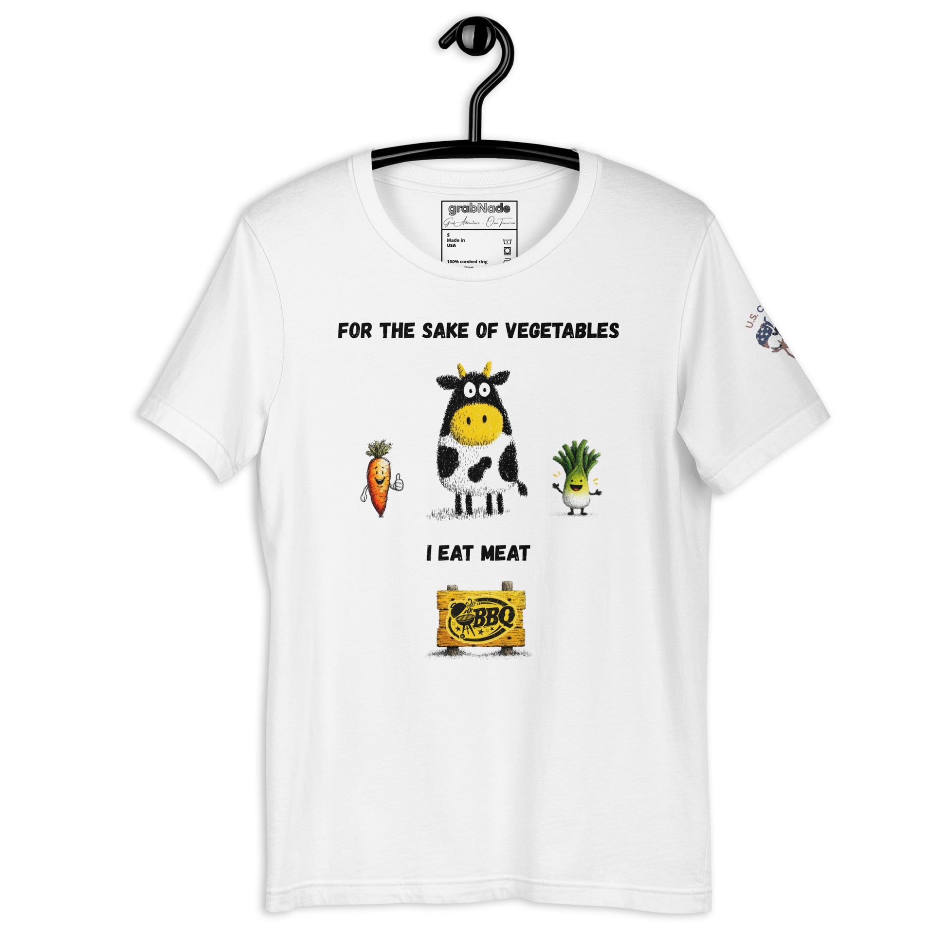 Product mockup. White T-shirt on hanger featuring a cartoon cow, carrot, and leek, with text: "For the sake of vegetables I eat meat" and a BBQ logo at the bottom.
