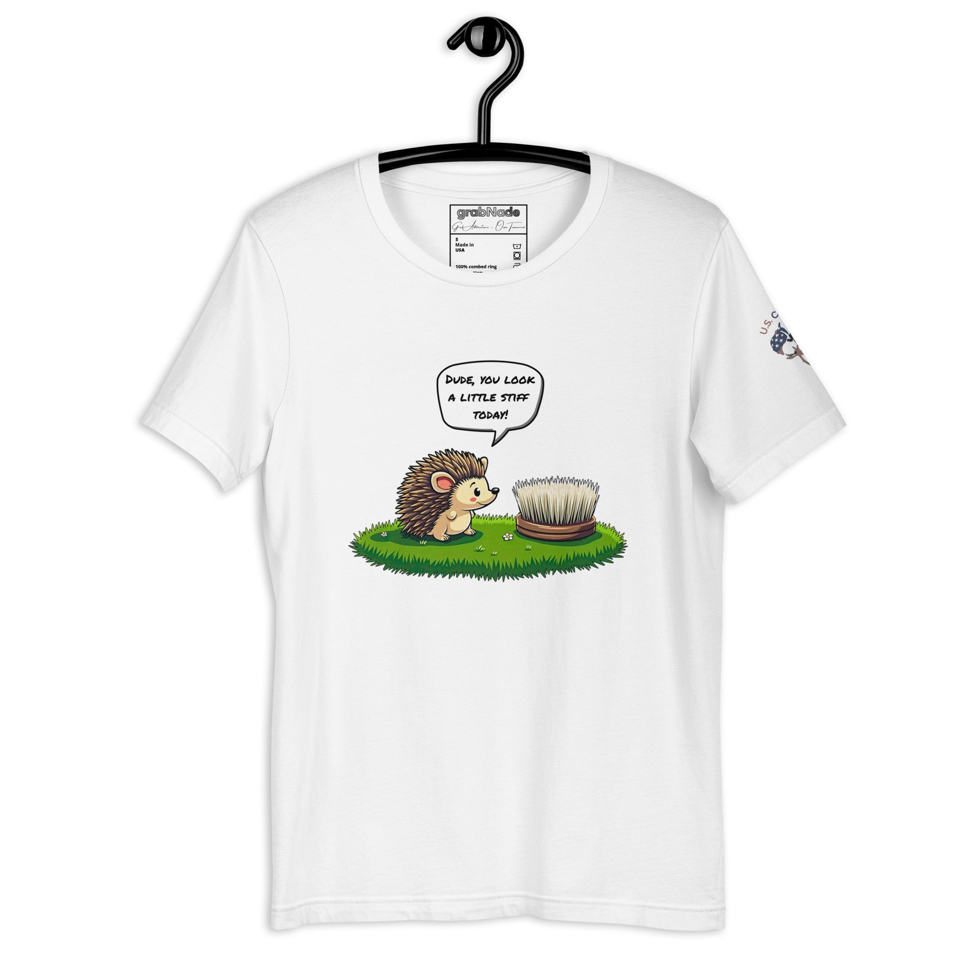 Product mockup. White T-shirt on hanger, cartoon hedgehog and brush, speech bubble: "DUDE, YOU LOOK A LITTLE STIFF TODAY!"