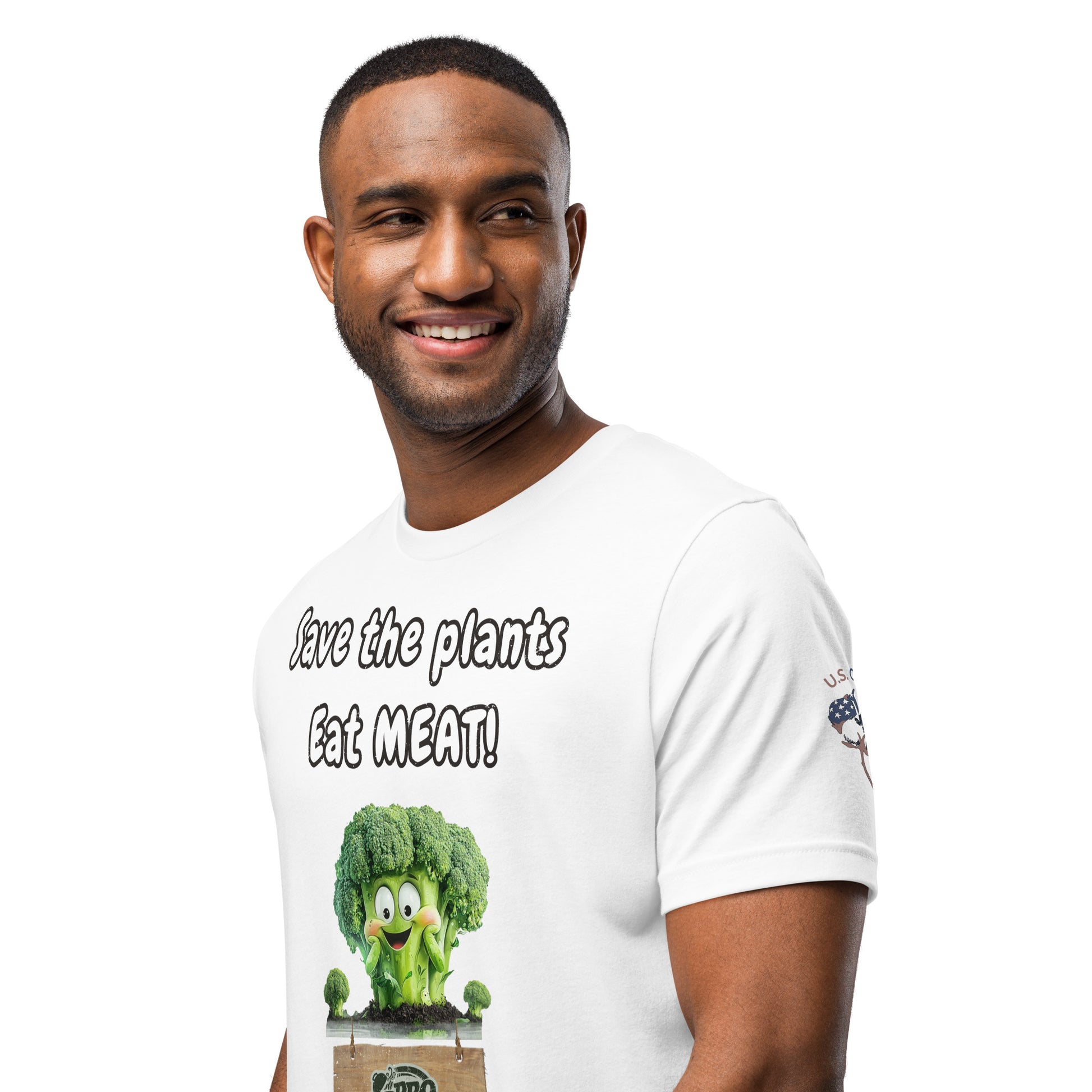 Product mockup. Man in a white T-shirt with "Save the plants Eat MEAT!" and cartoon broccoli, plus "U.S. Cotton" logo on right sleeve, upper body view, close-up from the torso up.