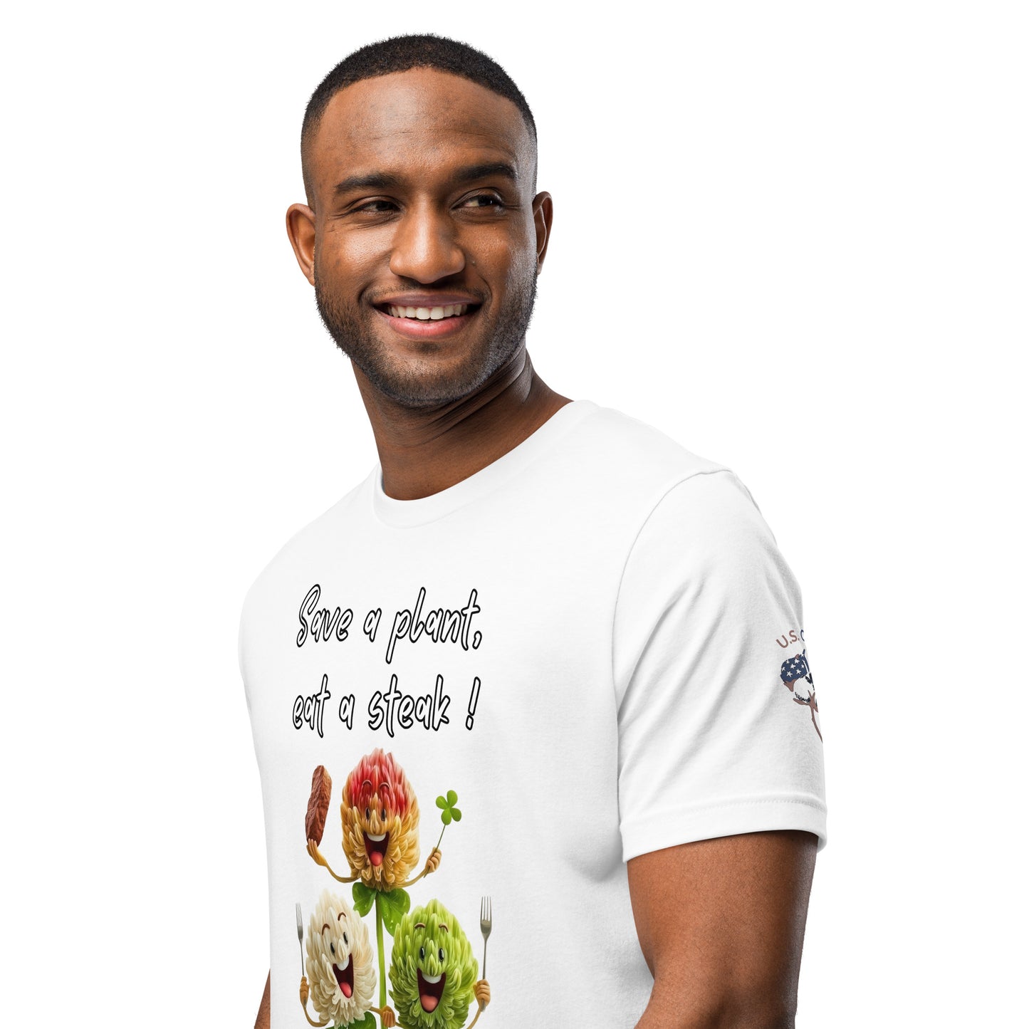 Product mockup. Man in white T-shirt with "Save a plant, eat a steak!" and smiling leafy vegetables, plus "U.S. Cotton" sleeve emblem, close-up from the torso up.
