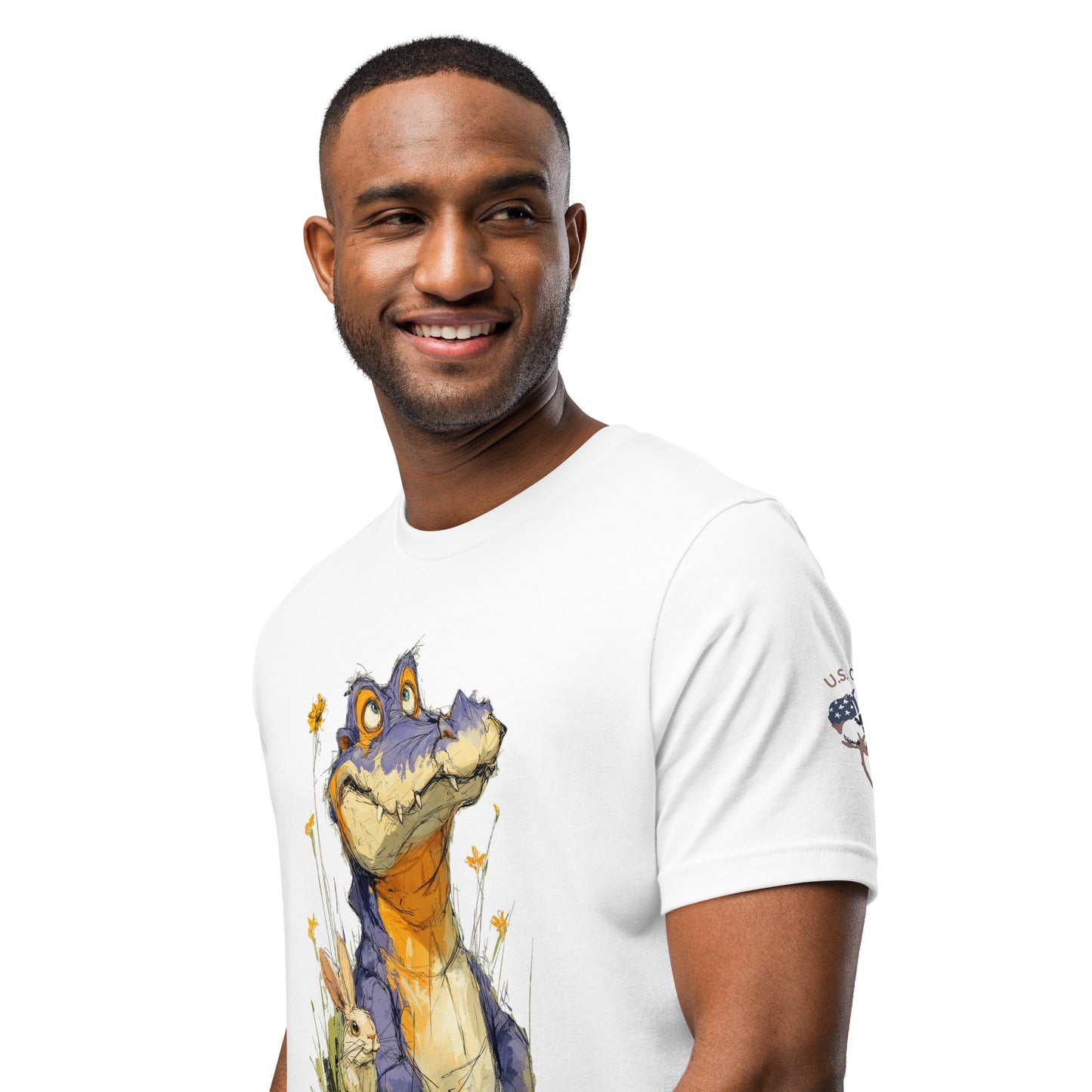 Product mockup. Man in white T-shirt showing a friendly cartoon alligator standing among yellow flowers, close-up from the torso up.