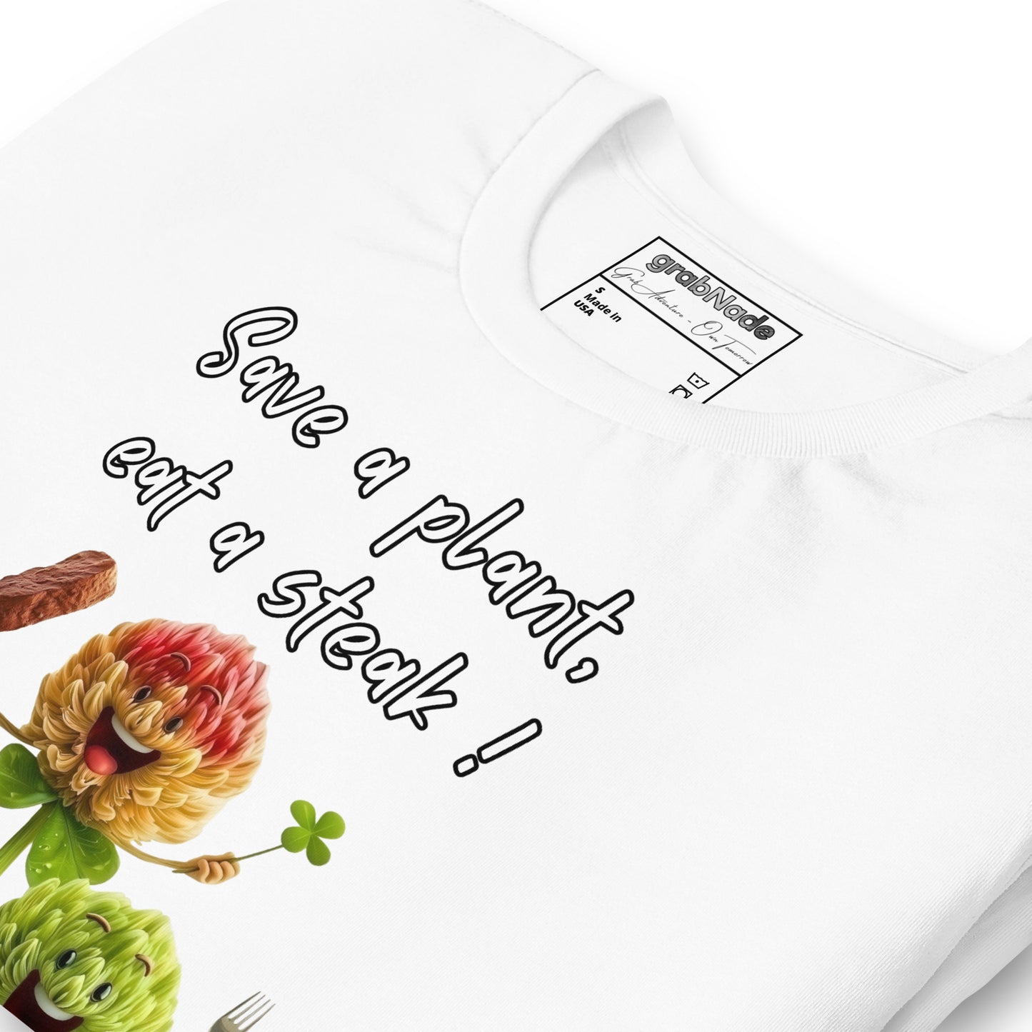 Product mockup. Close-up view of a white T-shirt featuring smiling cartoon flower characters, a steak, and the playful text “Save a plant, eat a steak!”.