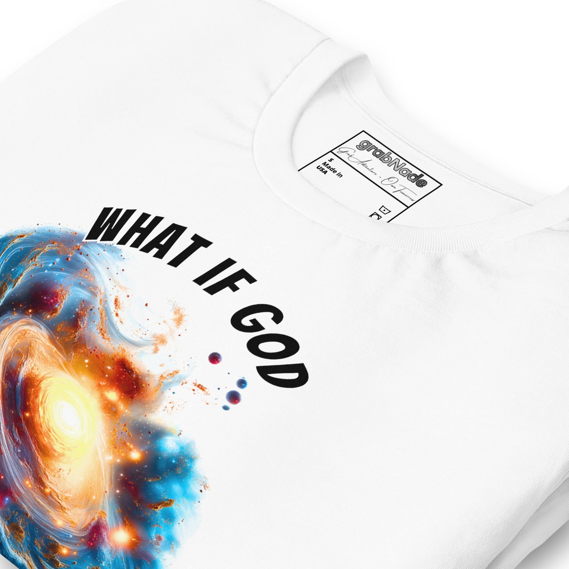Product mockup. White T-shirt, zoomed in, swirling space scene with nebula and galaxies, bold white text: "WHAT IF GOD".