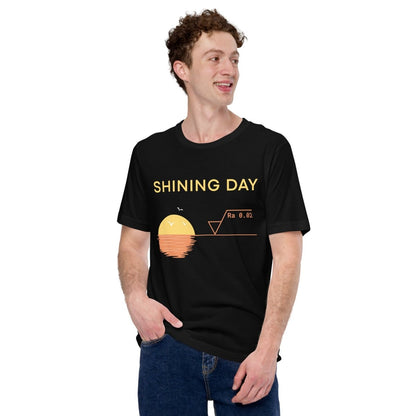 Man in black t-shirt featuring an Ra0.02 surface finish symbol on a geometric sunset horizon line.