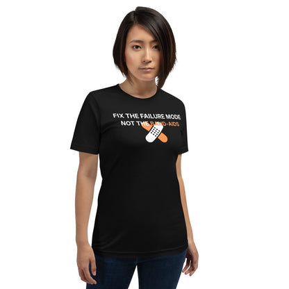 Woman in black t-shirt with "Fix the failure mode. Not the band-aids" text. For engineers & tech.