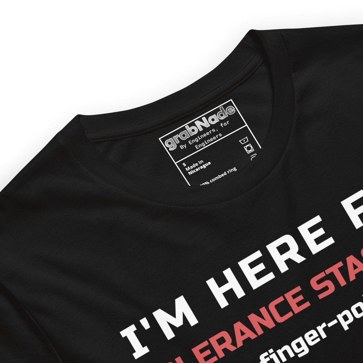 Close up of black premium t-shirt featuring tolerance stack-ups with orange and white typography. For manufacturing and mechanical engineers