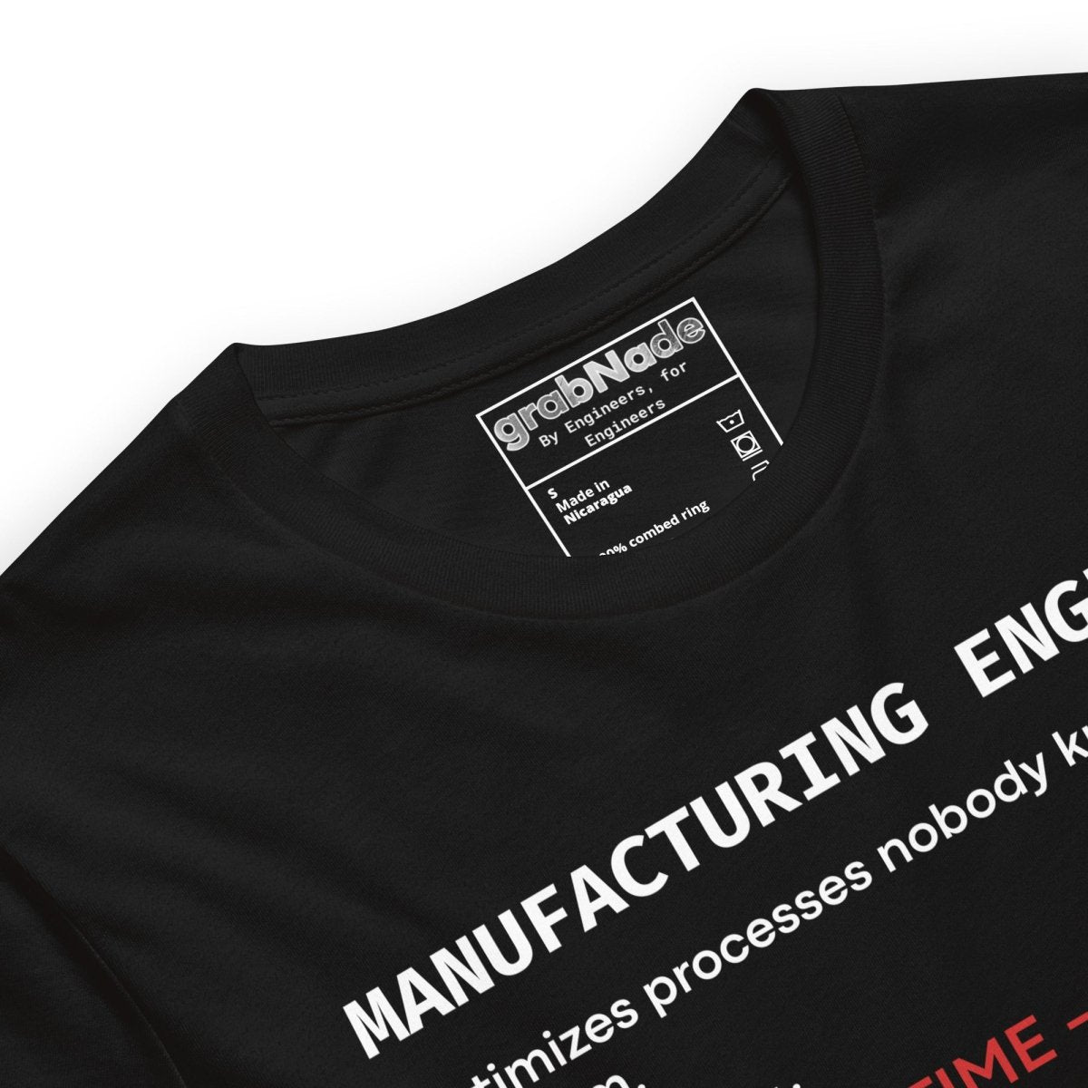 Close up of black t-shirt with "Manufacturing Engineer" definition featuring OEE and root cause terminology.