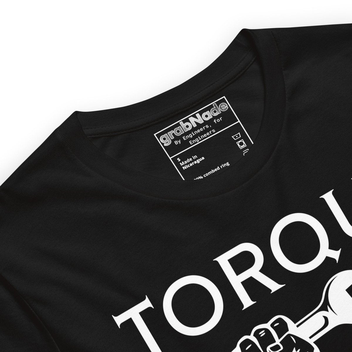 Close up of black t-shirt "TORQUE IT UP" with small screw overtighten vs big bolt undertighten warning.