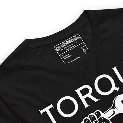 Close up of black t-shirt "TORQUE IT UP" with small screw overtighten vs big bolt undertighten warning.
