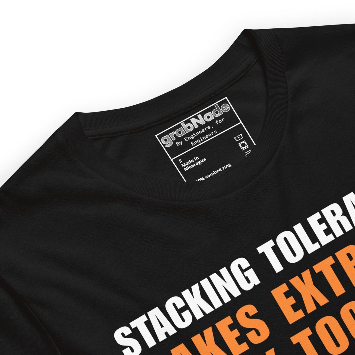 Close up of black t-shirt featuring a CAD blueprint graphic and stacking tolerances text for engineers.