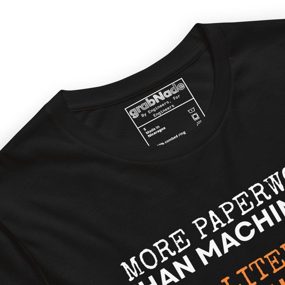 Close up of black t-shirt "Paperwork over machining is literature, not quality", for CNC machinists.
