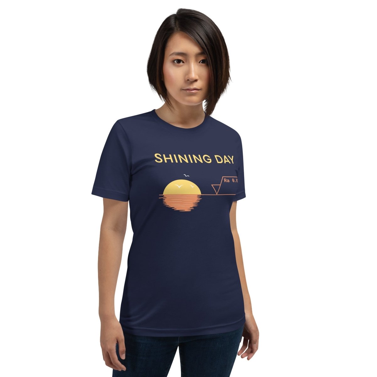 Woman in navy tee featuring an Ra0.02 surface finish symbol on a geometric sunset horizon line.