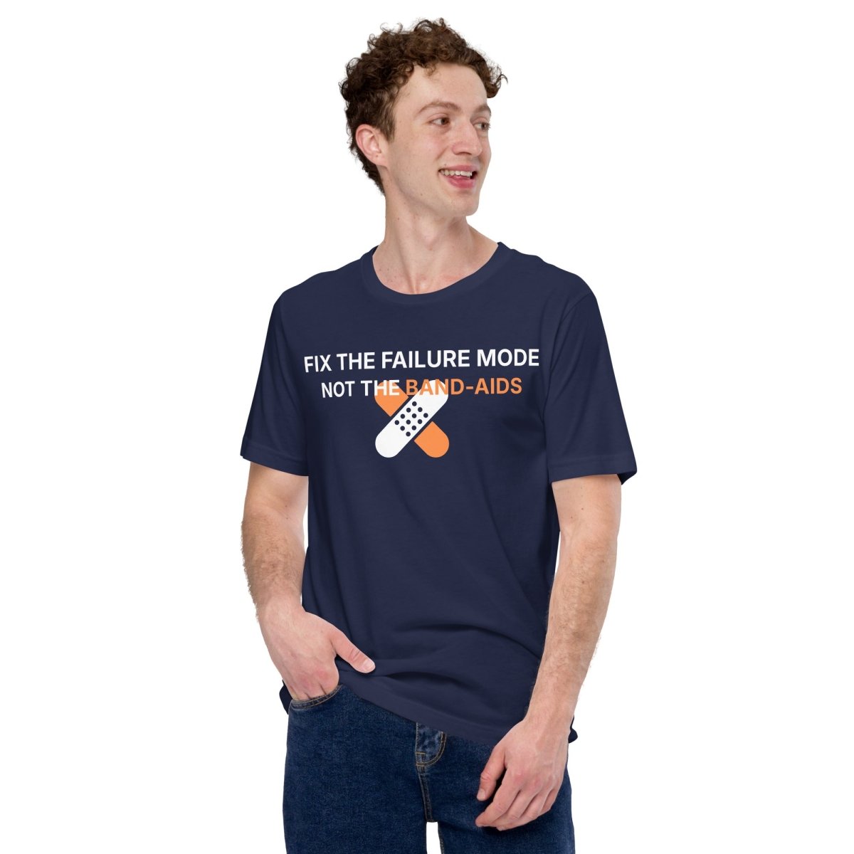 Man in navy t-shirt with "Fix the failure mode. Not the band-aids" text. For engineers & tech.