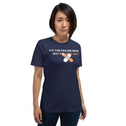 Woman in navy t-shirt with "Fix the failure mode. Not the band-aids" text. For engineers & tech.
