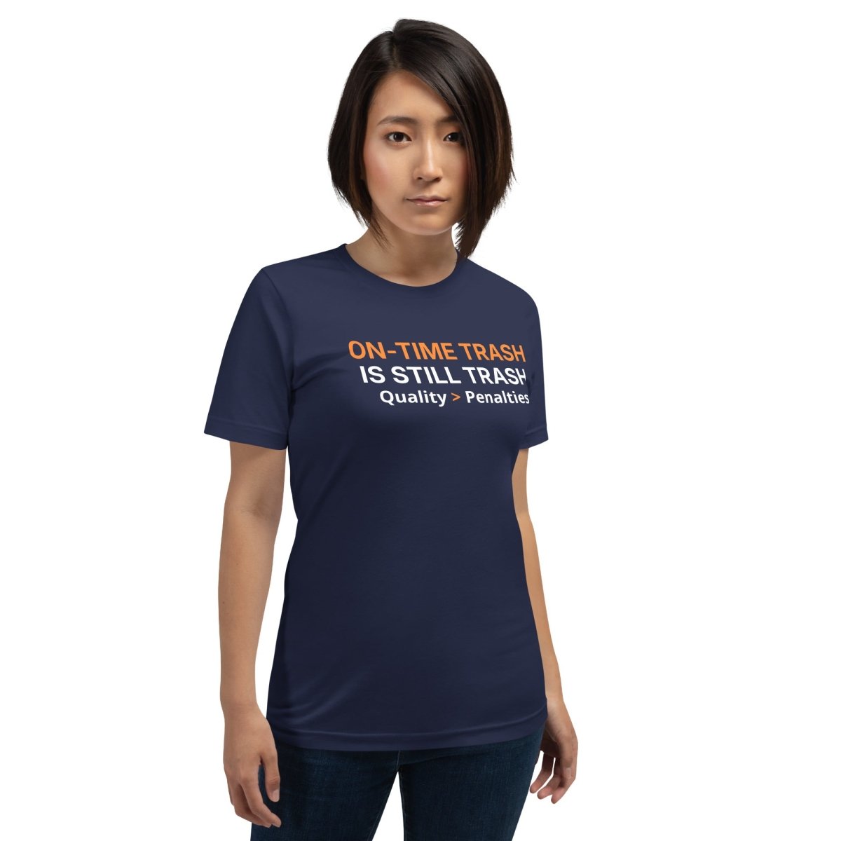 Woman in navy tee featuring "ON-TIME Trash is still Trash" for manufacturing and quality engineers.