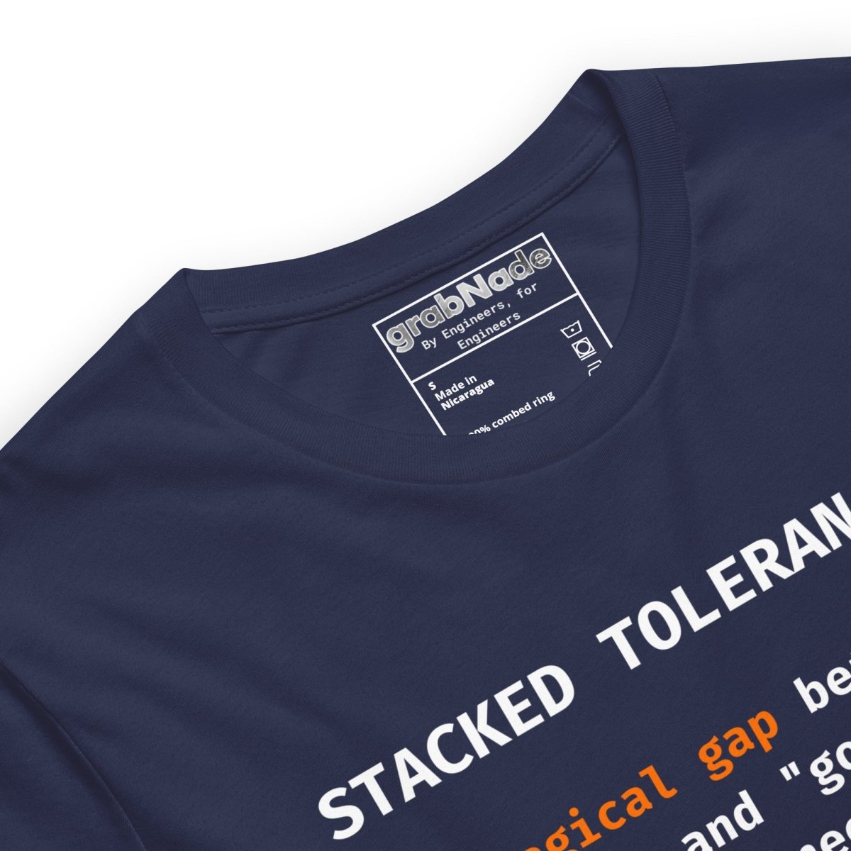 Close  up of navy t-shirt with "Stacked Tolerances magical gap perfect good enough" engineering definition.
