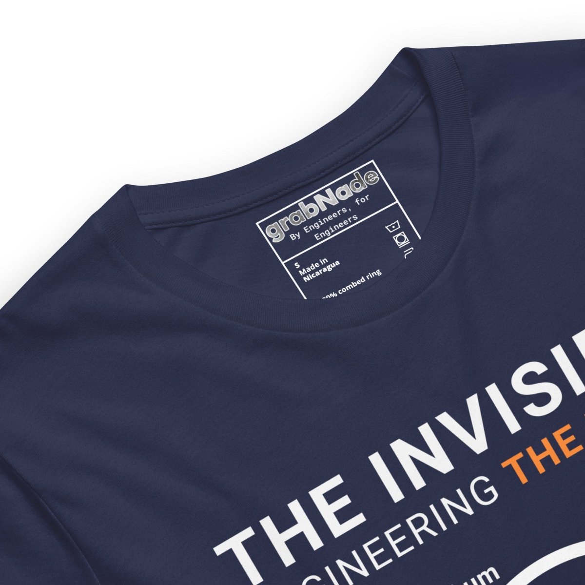 Close up of navy t-shirt "Engineering the Micron" scale graphic: hair 75µm to 1µm for eng & machinists.