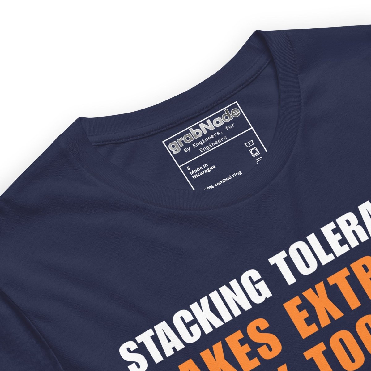 Close up of navy t-shirt featuring a CAD blueprint graphic and stacking tolerances text for engineers.