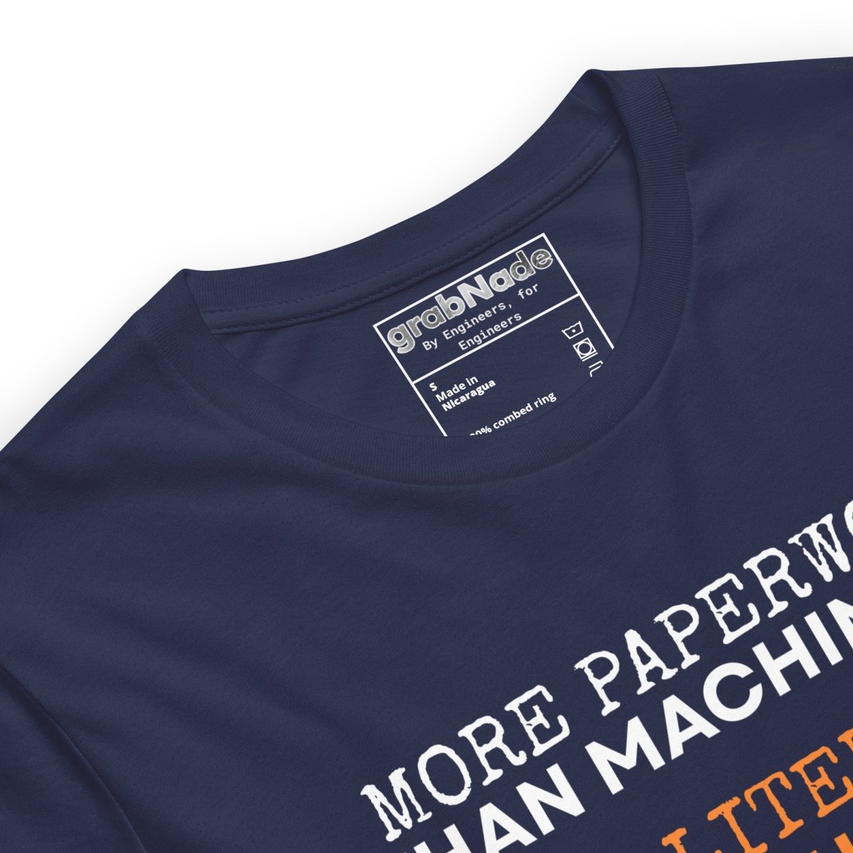 Close up of navy t-shirt "Paperwork over machining is literature, not quality", for CNC machinists.