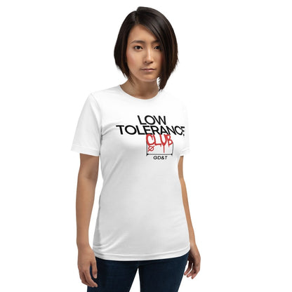 Woman in white t-shirt with "LOW TOLERANCE CLUB" dripping precision tolerance numbers graphic.