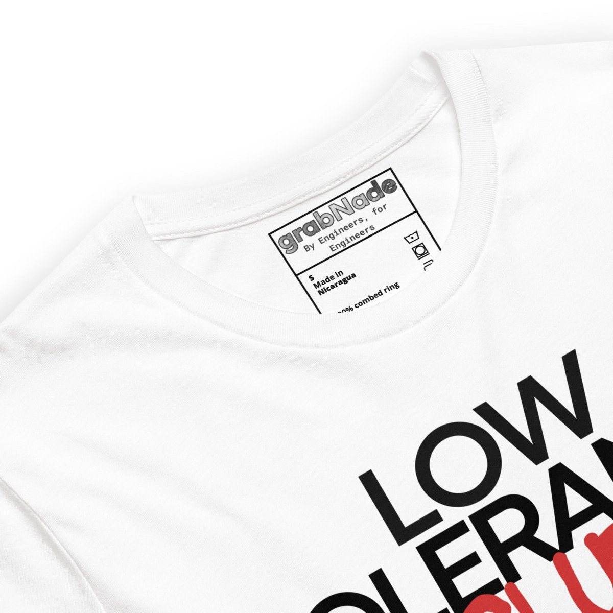 Close up of white t-shirt with "LOW TOLERANCE CLUB" dripping precision tolerance numbers graphic.