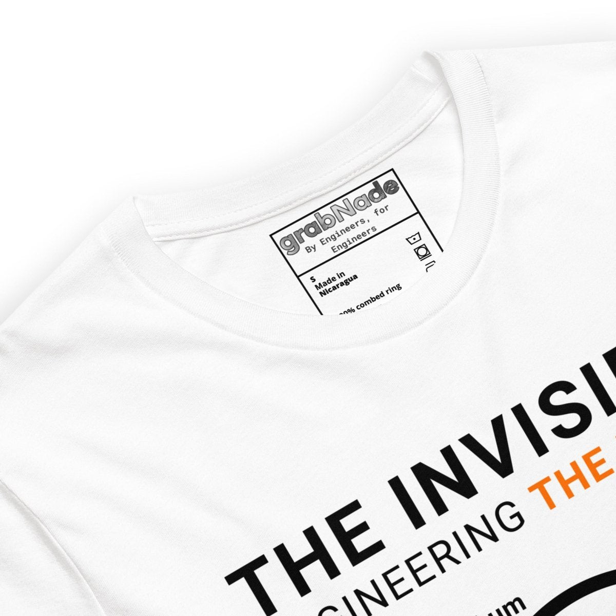 Close up of white t-shirt "Engineering the Micron" scale graphic: hair 75µm to 1µm for eng & machinists.