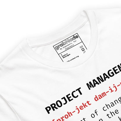 Close up of white t-shirt "Project Management [proh-jekt dam-ij-ment] ctrl+alt+pray" definition.